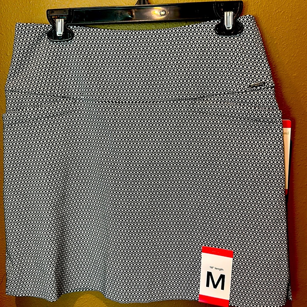 Skort. NEW. Stylish, 18 inches in length. Stretch under short. So comfy.